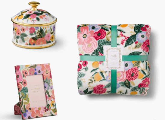 Product image of a folded blanket, picture frame, and trinket box with a matching floral design.