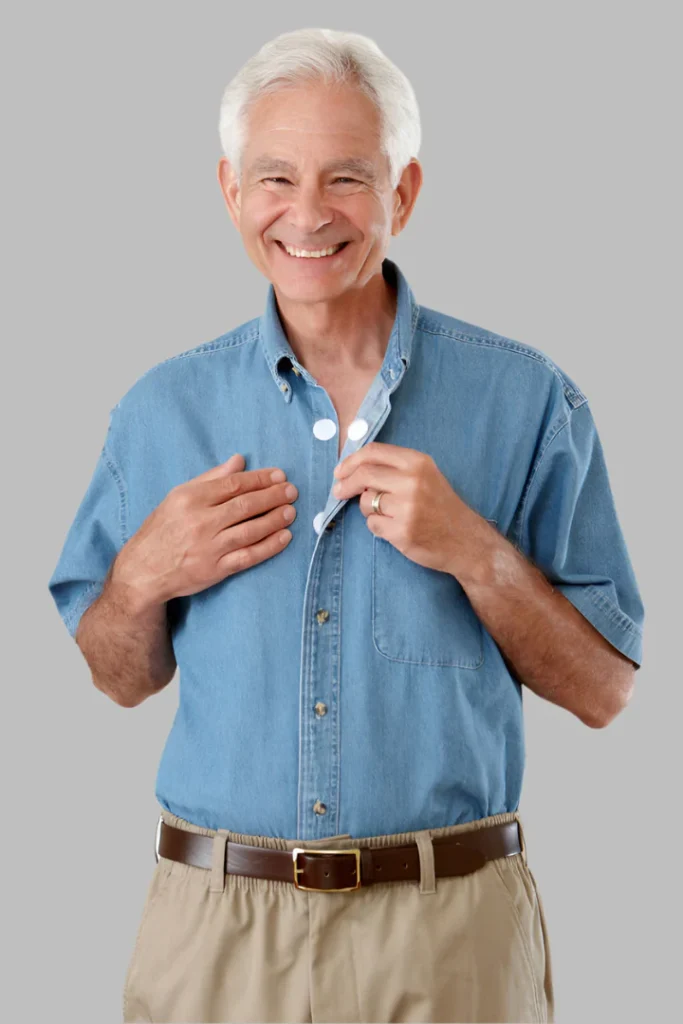 Photo of an older adult man wearing a Buck & Buck button-down shirt, showing the internal Velcro closures behind the buttons