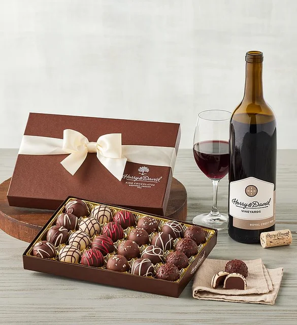 A product image showing a bottle of red wine and a box of chocolate truffles.